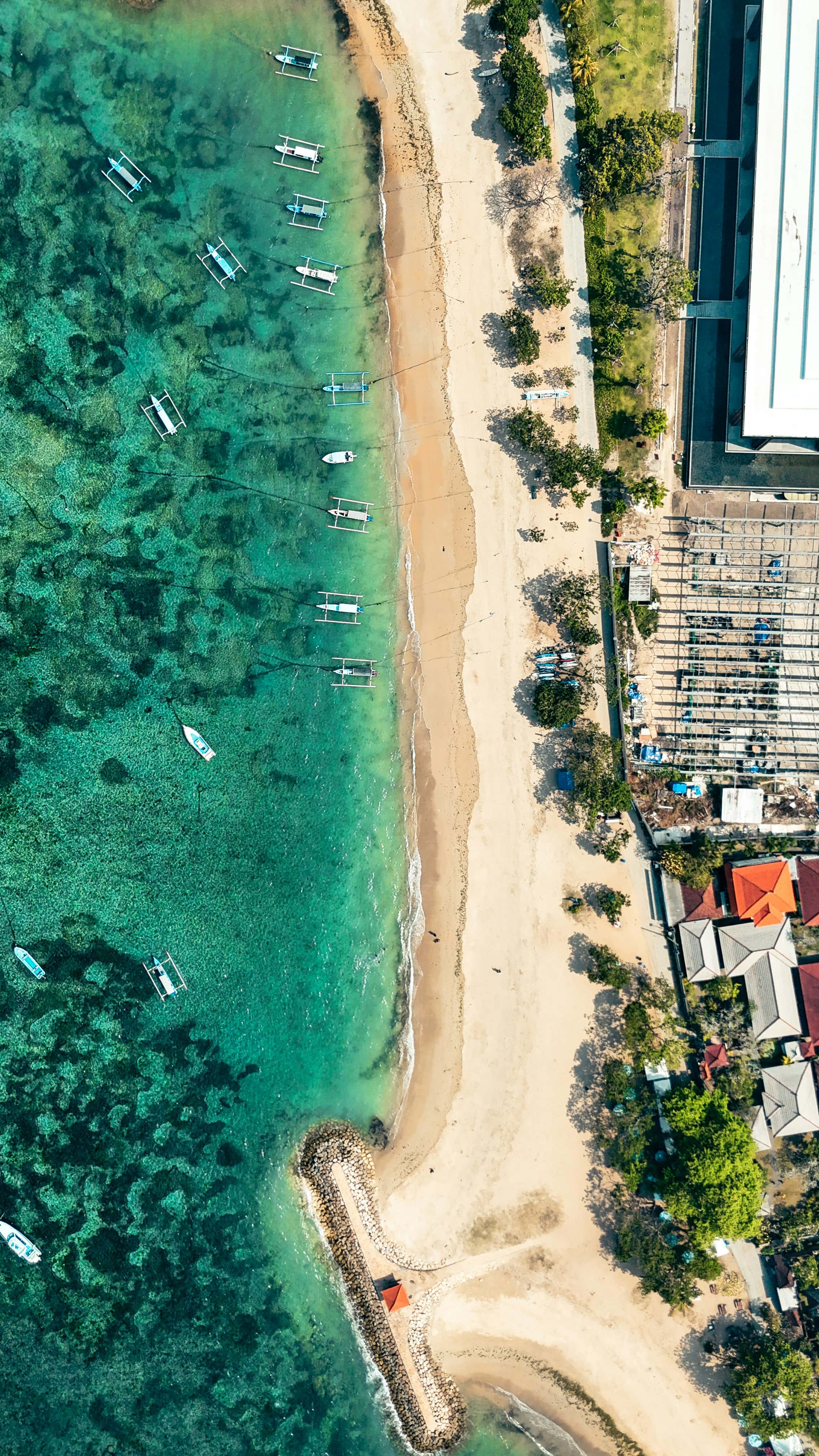 Sanur beach and reef from the air with boats