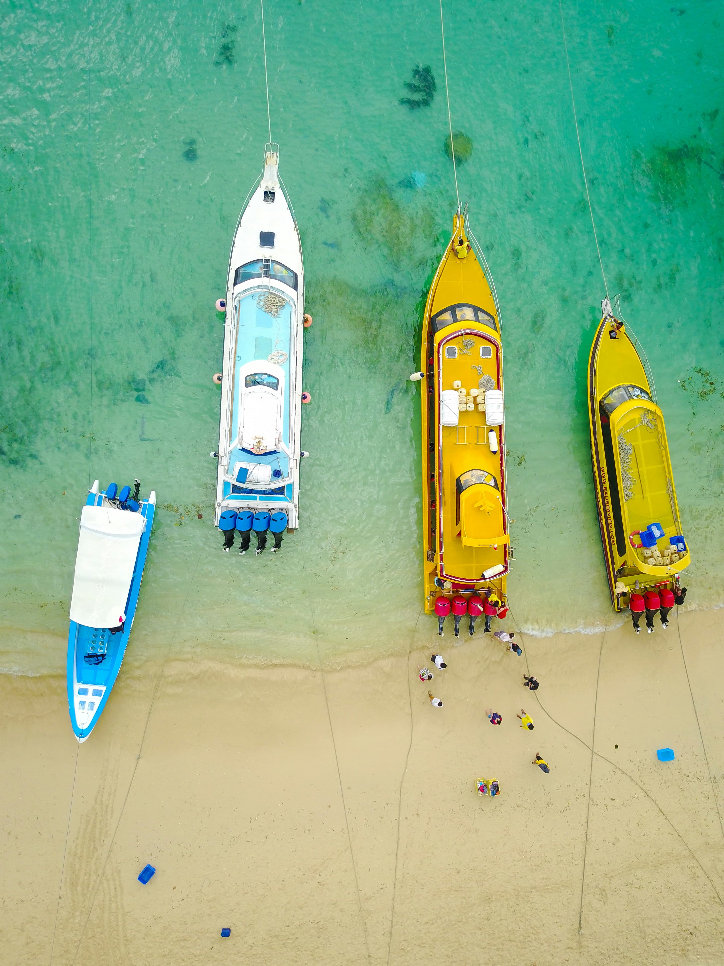 Fast boats moored on turquoise water off Nusa Lembongan