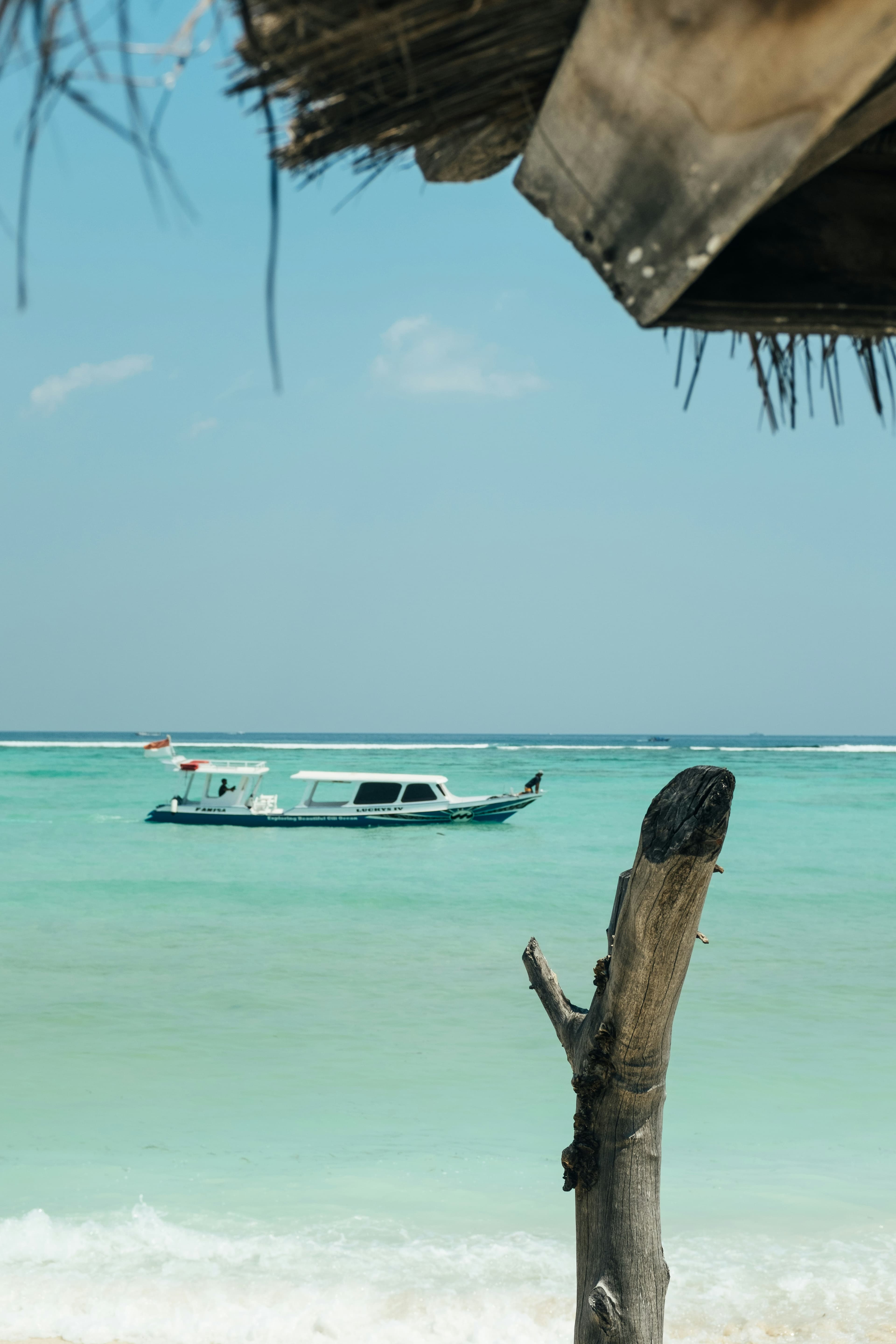 White boat on clear water at Gili Air